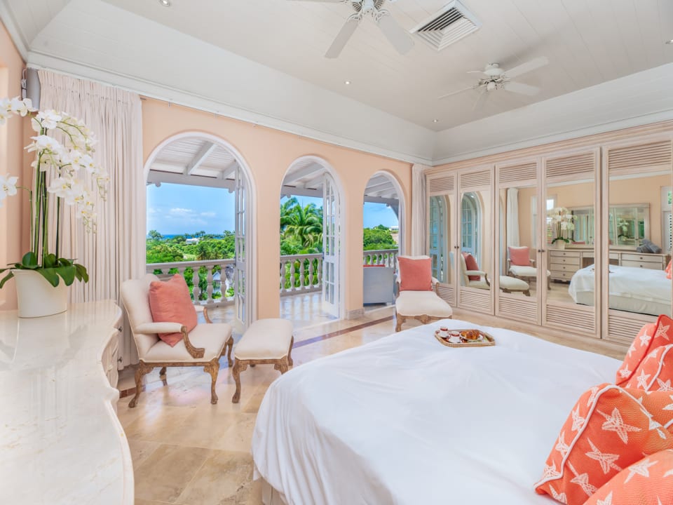 Primary Bedroom with estate and sea views