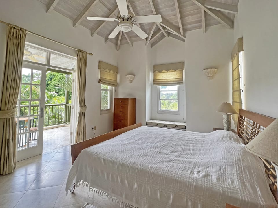 Primary bedroom with balcony