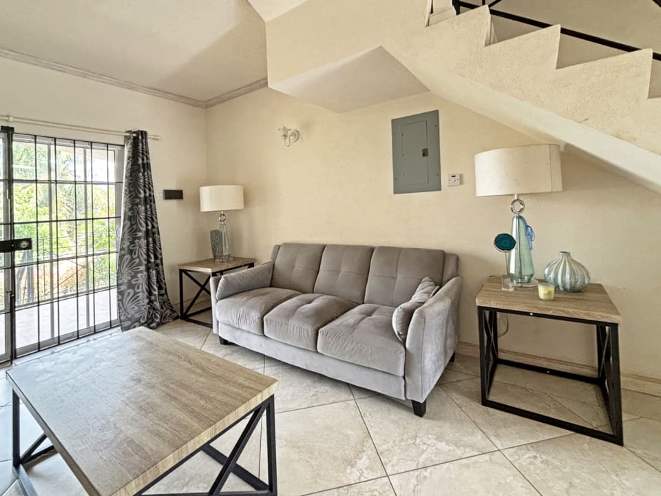 Open plan living area leading to patio terrace