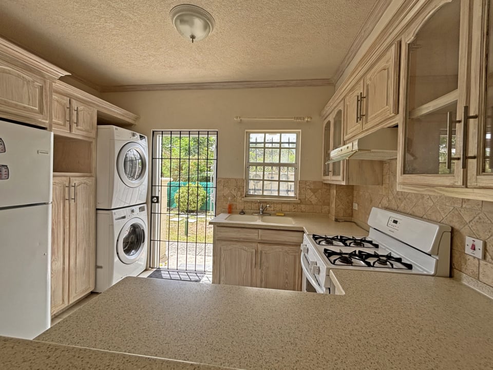 Kitchen area leading from front porch