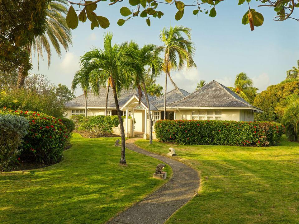 Surrounded by well-manicured lawns and trees