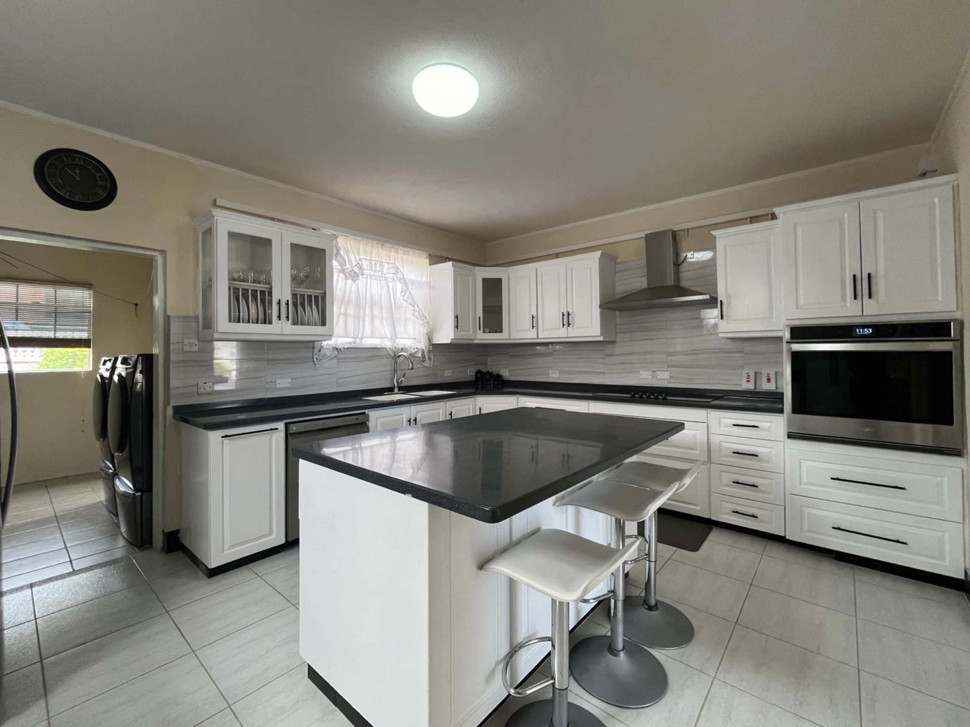 Modern, spacious kitchen with laundry area