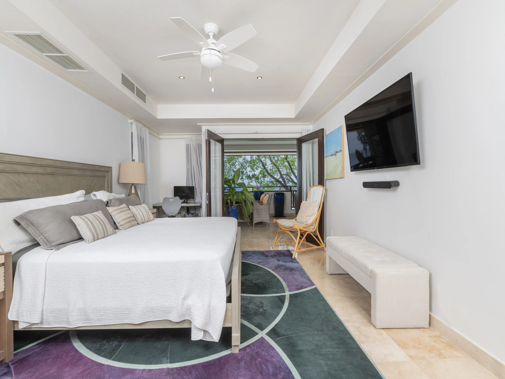 Primary bedroom suite leading to patio terrace