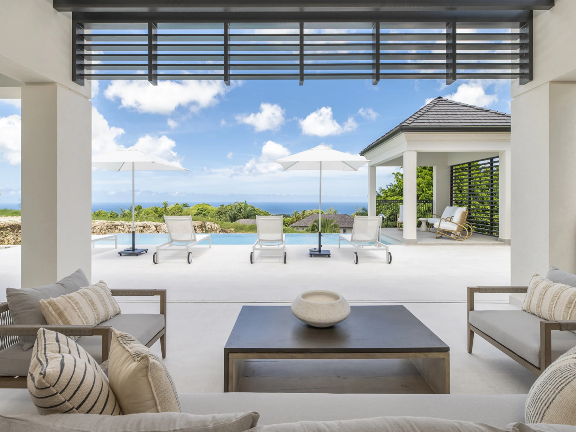 Living space opening out to the private pool and outdoor seating area