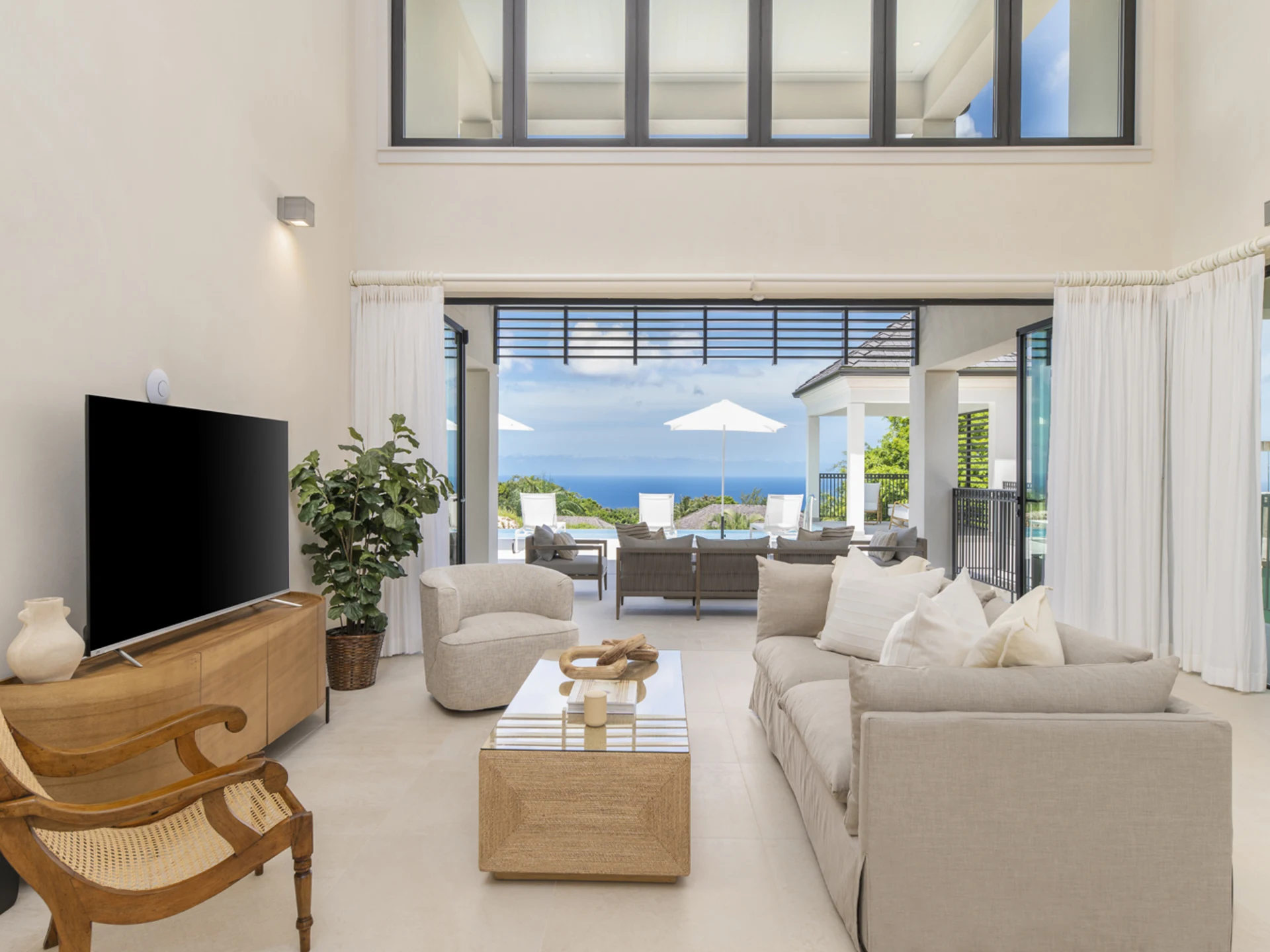 Spacious living room opening out to a spacious patio