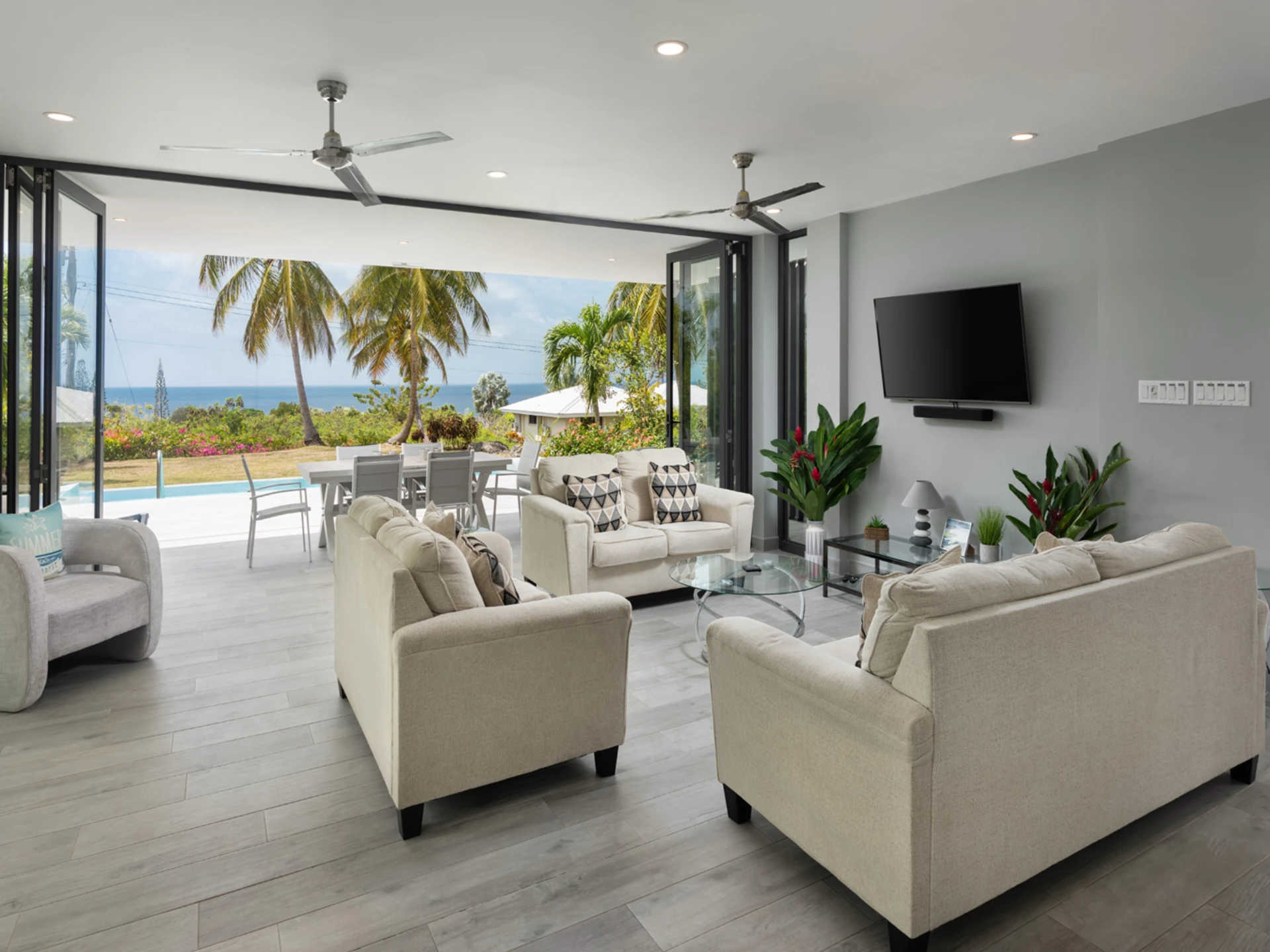 Sitting room opens to dining terrace and pool