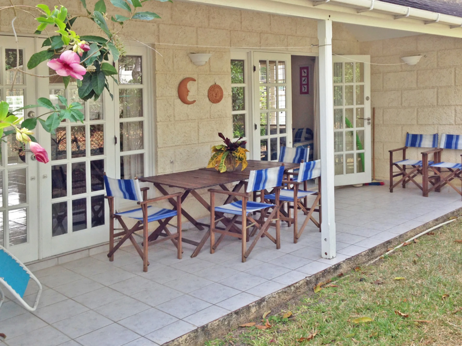 Covered verandah opens to lawn