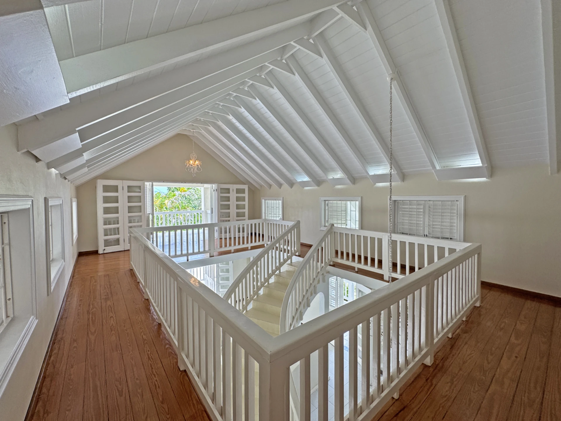 Upper level wrap around has wooden floors