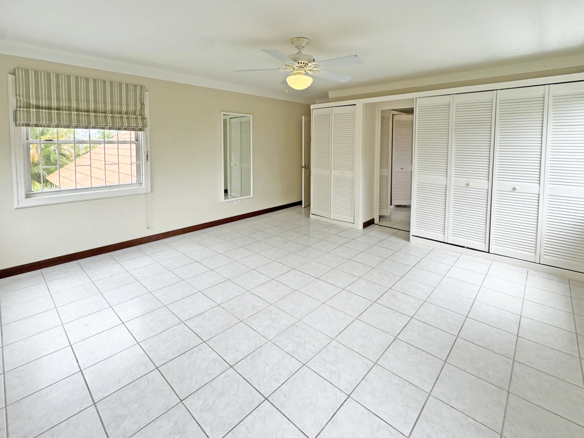 Spacious primary bedroom upstairs