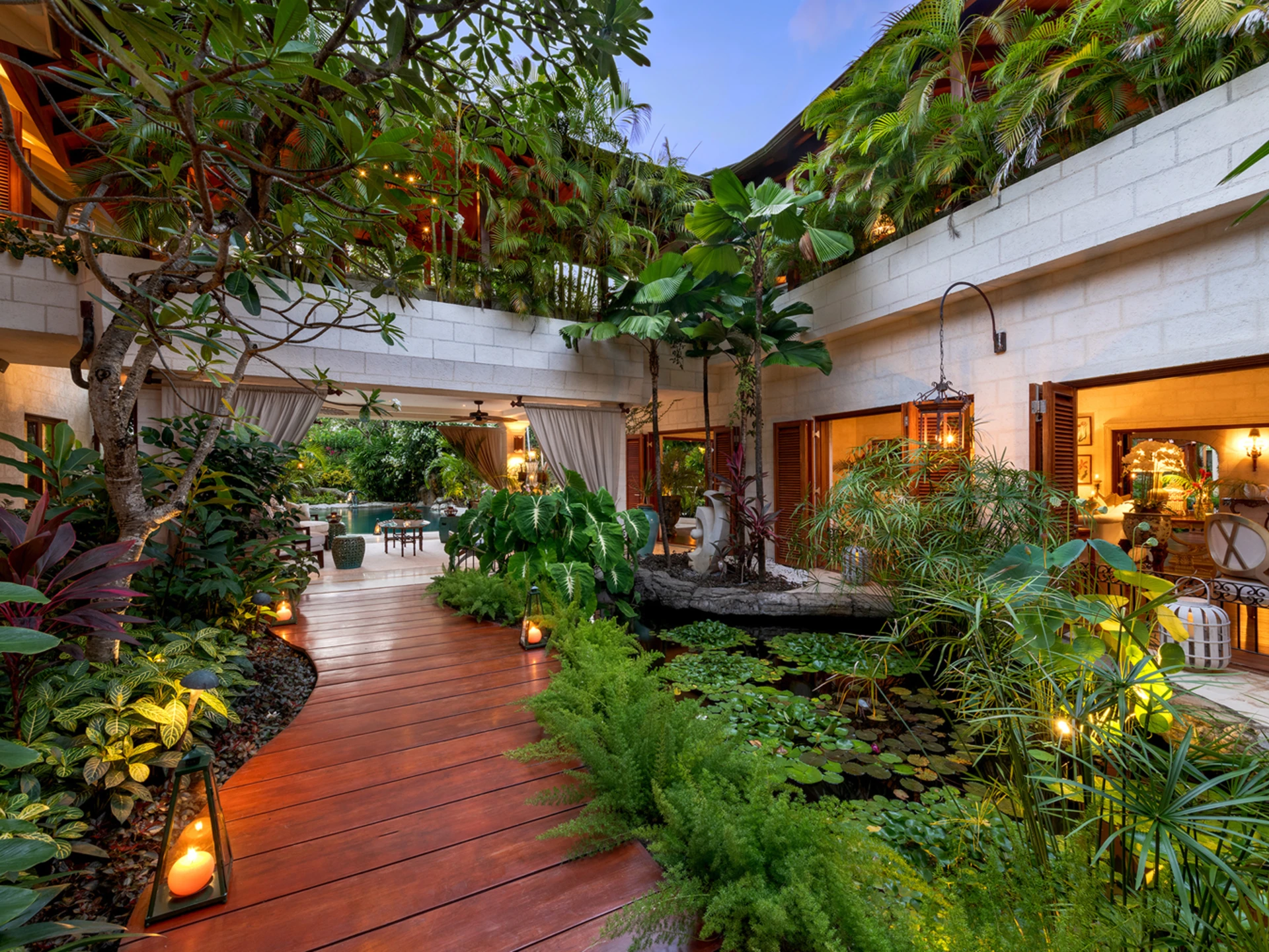 Teak walkway and gardens through the house