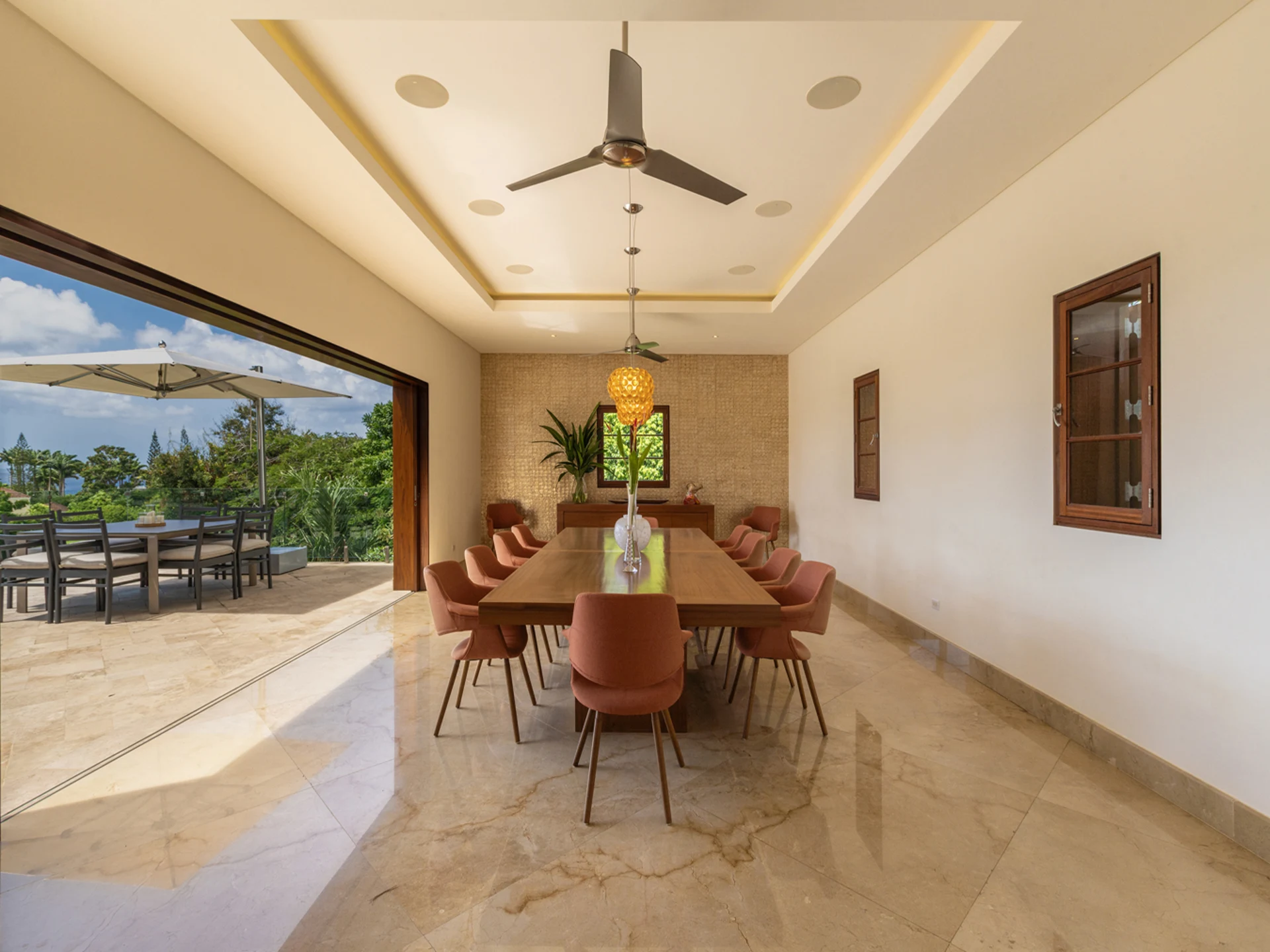 Dining Room Accented With A Mother Of Pearl Wall And Stunning Sea Views
