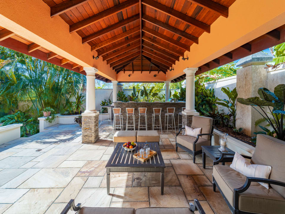 Outdoor living area with a bar