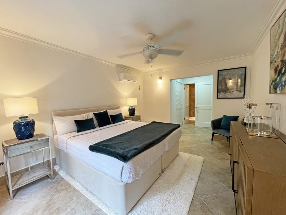 Bedroom with ceiling fans and AC