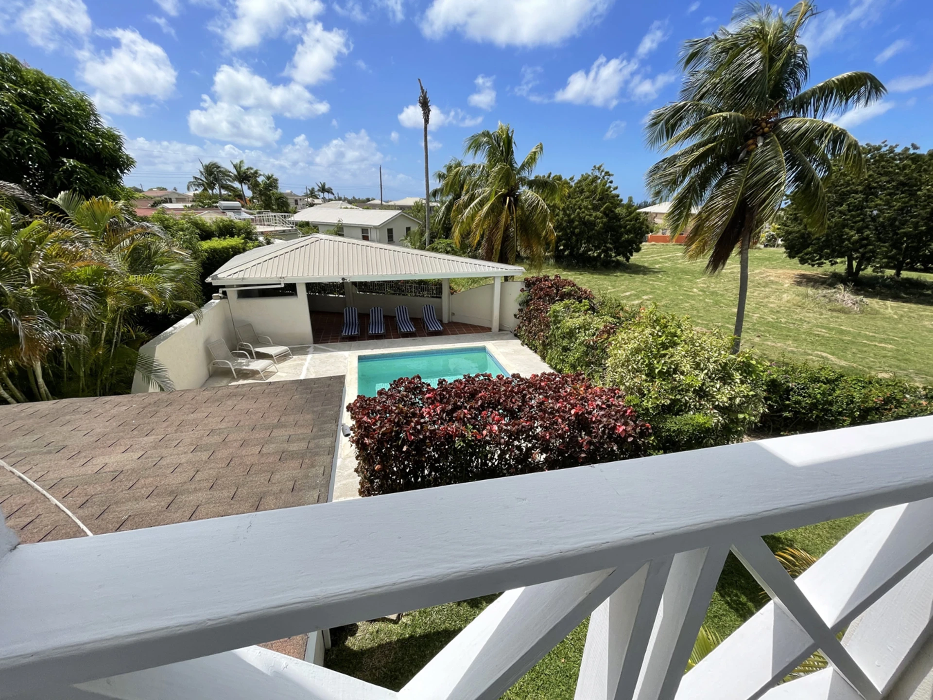 View from main bedroom balcony of pool