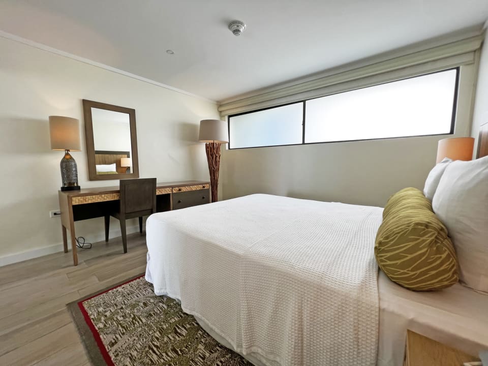 Guest Bedroom with views to the gardens and pool