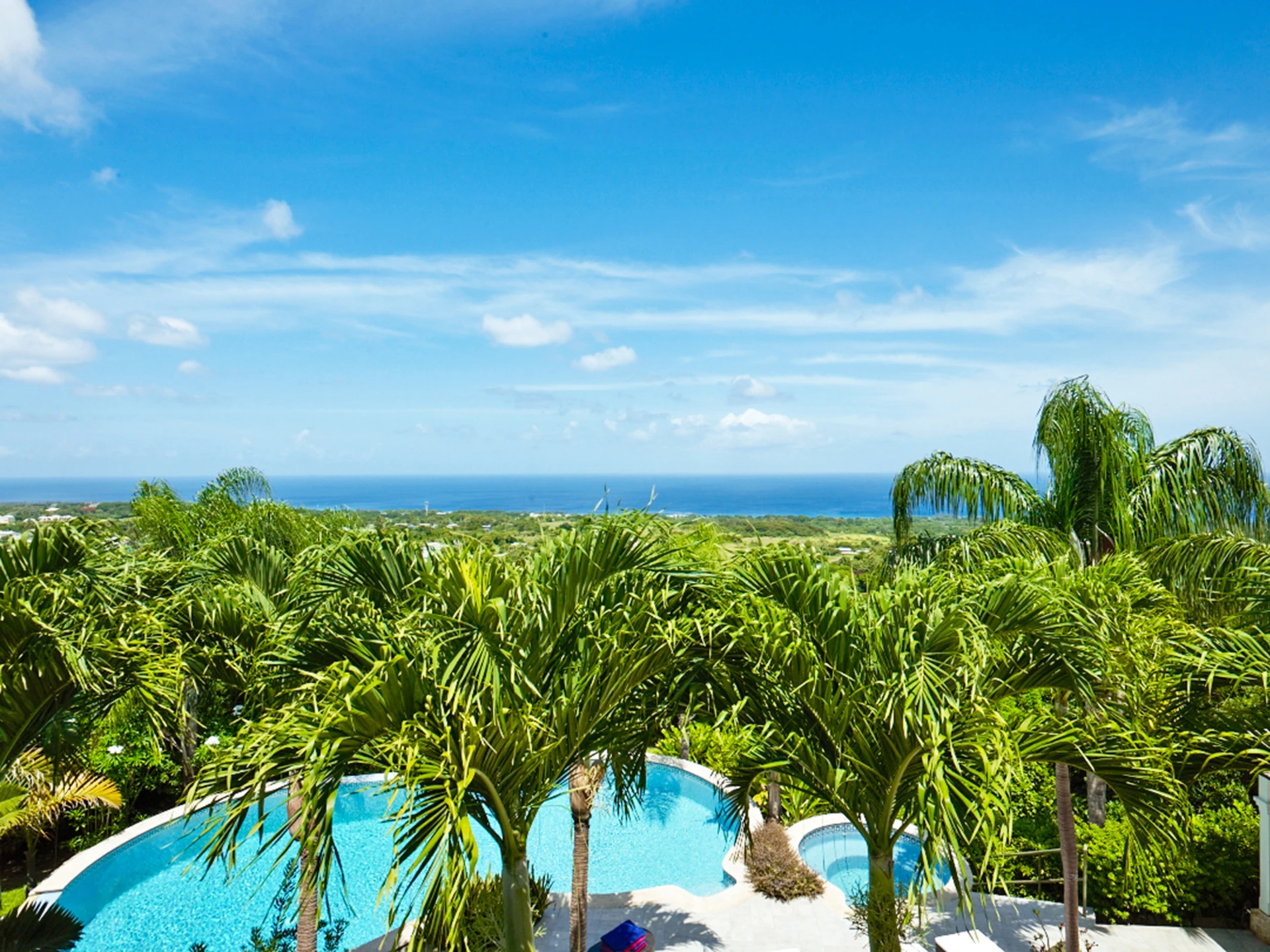 Stunning views of the pool, garden and ocean beyond