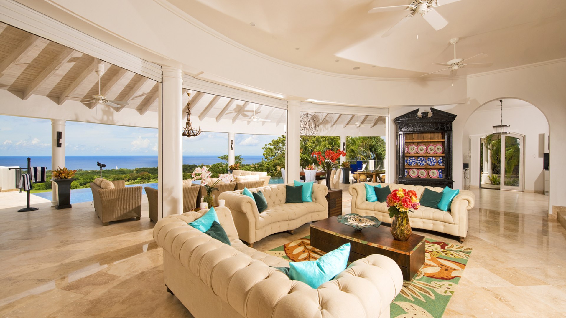 Main living area with opening to the outdoor pool terrace