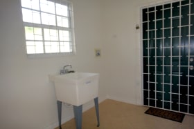 Laundry room with access to back garden