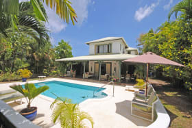 View of Villa Creole and swimming pool from the garden