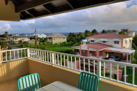 Pocket sea views from terrace with dining