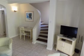 Living area and stairs to bedroom