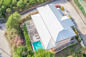 View from overhead with drive-way and pooldeck