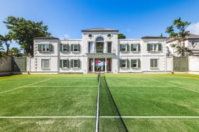 Enjoy a match of lawn tennis on your own private court