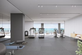 Gym with large sea-facing windows.