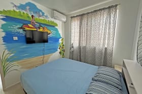 Bedroom with beach scene mural