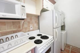 Kitchen with washer and dryer