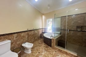 Lower primary bathroom with bathtub