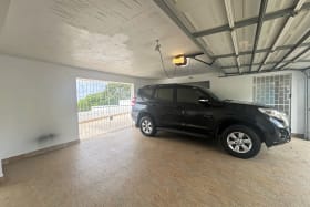 Secure, enclosed garage fits two vehicles
