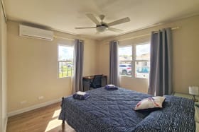 Bedroom 2 with a desk and air conditioner