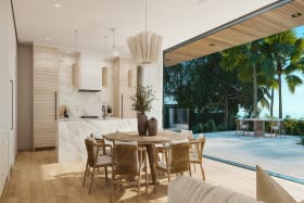 breakfast area that opens out onto the pool and sea beyond