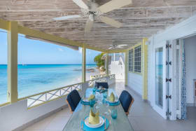 Dining terrace and stairs to sandy cove