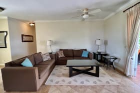 Living area opens onto a large patio and deck