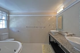 En-suite primary bathroom with tub