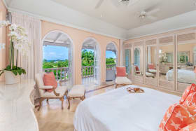 Primary Bedroom with estate and sea views