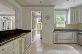 Spacious kitchen with marble countertops