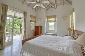 Primary bedroom with balcony