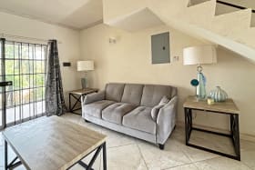 Open plan living area leading to patio terrace