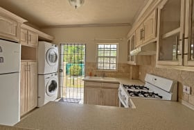 Kitchen area leading from front porch