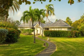 Surrounded by well-manicured lawns and trees