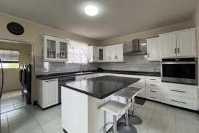 Modern, spacious kitchen with laundry area