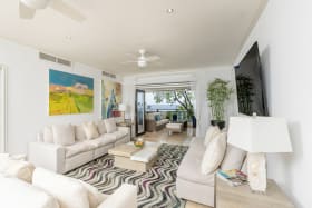 Open plan living room leading to the patio terrace