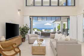 Spacious living room opening out to a spacious patio