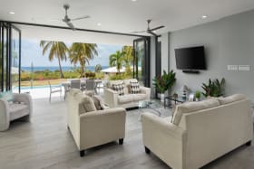 Sitting room opens to dining terrace and pool