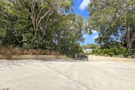 Expansive driveway with gated entry