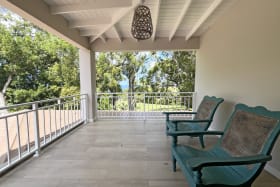 Private terrace with distant sea views off the main bedroom