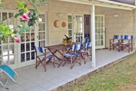 Covered verandah opens to lawn